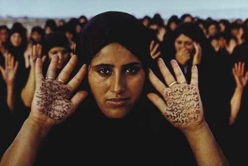 ArtChart | Rapture Series (women with writing on hands) by Shirin Neshat